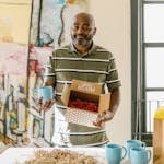 A Man Packing Cups for Delivery
